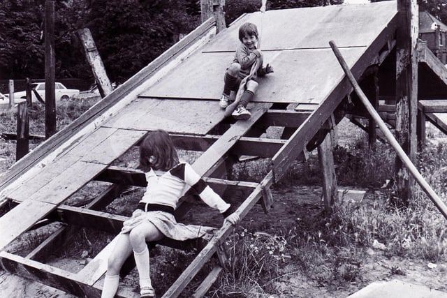 Nine year old Karen Broadhurst and her seven year old brother Craig of Clubgarden Road, Broomhill, playing in Broomhall adventure playground on August 20, 1979