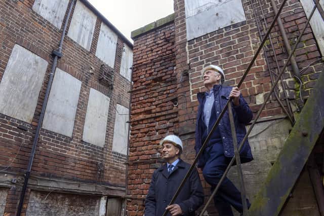 A tour of the grade II listed Leah's Yard, part of the council's transformative Heart Of The City II programme. Clr Councillor Mazher Iqbal and former worker Philip Drury. Picture Scott Merrylees