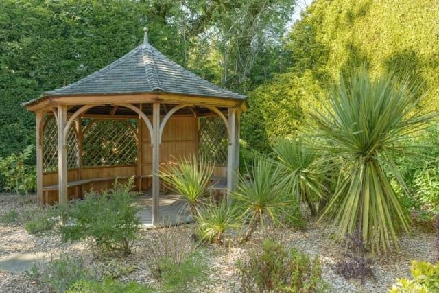 Landscape gardens surround the property and a beautiful wooden gazebo with scented climbers offers a relaxing rest spot.