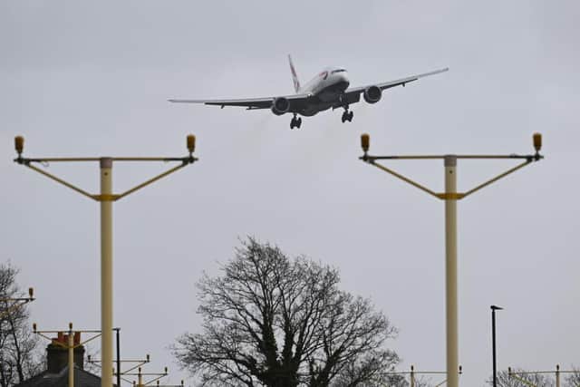 Dozens of flights have been cancelled today as high winds batter the nation. A livestream by plane spotter Big Jets TV has shown hundreds of thousands viewers the difficulties of landing today. (Photo by Leon Neal/Getty Images)