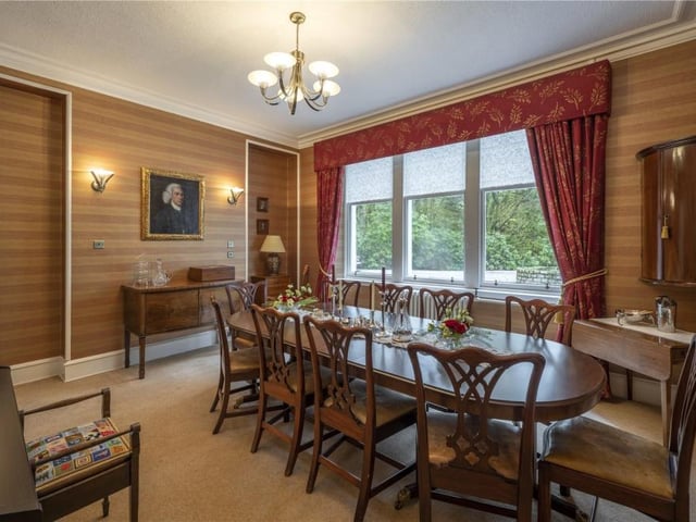 The well appointed dining room reflects the grand country house origins of the home with its handy butler's pantry.