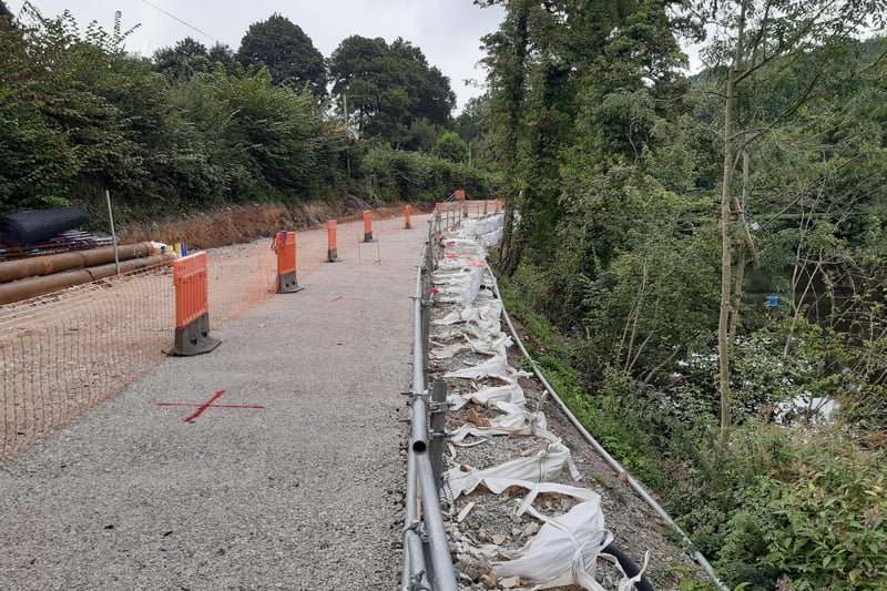 A county council spokesperson said: "Following on from unusually heavy rain over a weekend in early May, the contractors found that the landslip was still moving and that a sewer running under the road was leaking. Repairs were made to the sewer and drainage was installed."