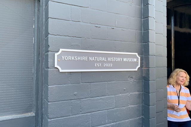 This plaque outside proudly shares the museum's name and it's recent opening.