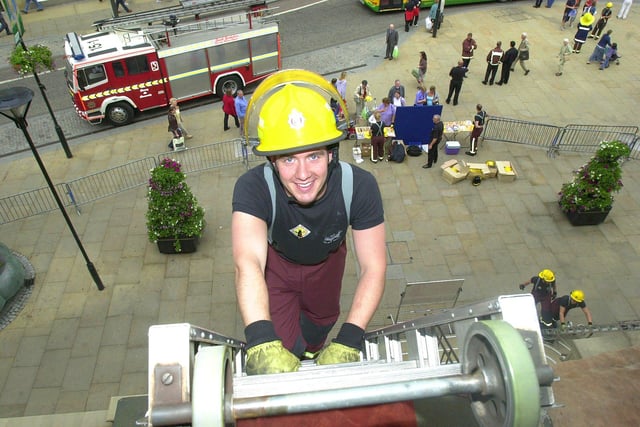 Ashley Gyte from North Anston, one of twenty trainee firefighters scaling the Town hall 1000 times for charity back in 2003