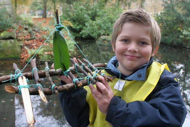 Go Wild, Whitworth Park, seven year old Matthew Swindell with his boat made from woodland materials
