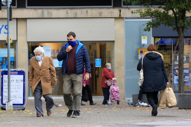 Shoppers wear face masks while in the town centre
