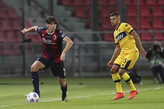 Bologna's Aaron Hickey, left, controls the ball during of a Serie A soccer match between Bologna and Parma at the Renato Dall'Ara Stadium last night. (Filippo Rubin/LaPresse via AP)