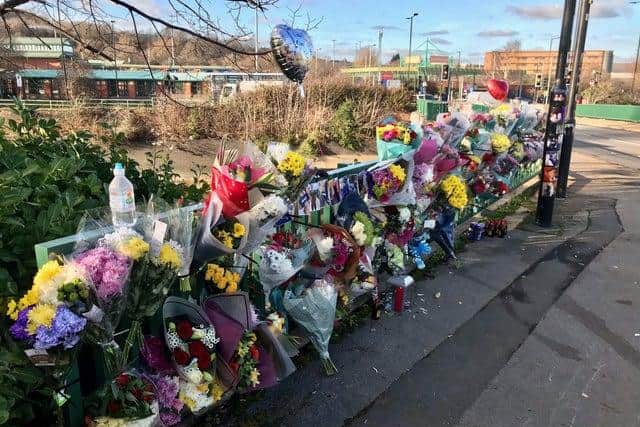 Floral tributes were left on Meadowhall Way where a car left the road and plummeted into the River Don below, killing Tommy Hydes and his nephew, Josh Hydes