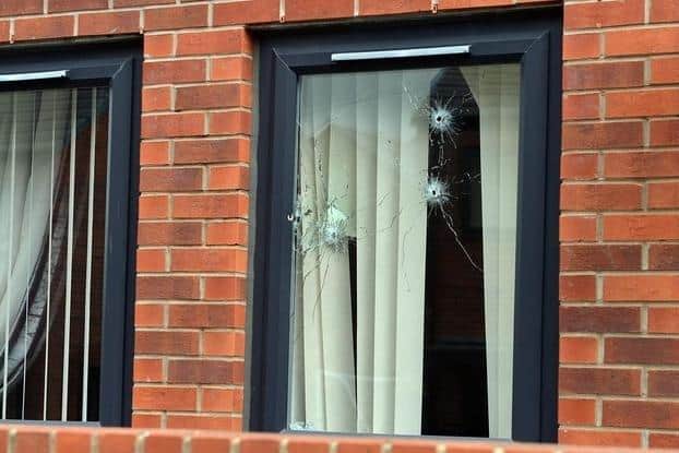 Bullet holes in the window of a home on Errington Avenue, near Arbourthorne, Sheffield