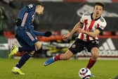 Ethan Ampadu of Sheffield United tussles with Gabriel Martinelli of Arsenal: Andrew Yates / Sportimage