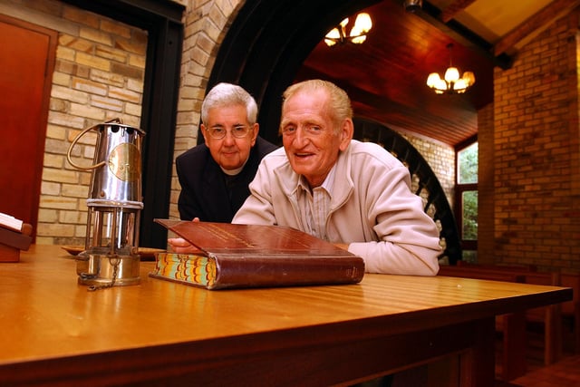 Vicar Reg Davis and former miner Ronnie Stocks, complete with miners' lamp, at The Miners Chapel at All Saints Church, Denaby Main pictured in 2004