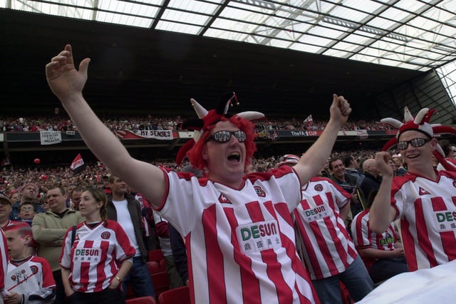 United fans enjoy their day out watching the Blades play Arsenal in the FA Cup semi-final at Old Trafford in April 2003.