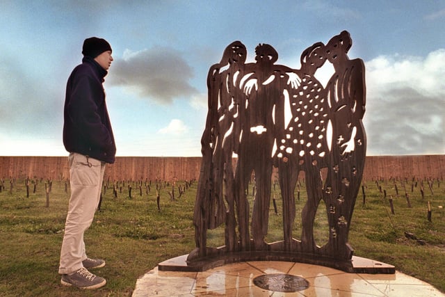 A teenager looked at the life-size metal sculpture of four young people by Doncaster based artist Hilary Cartmel back in 1999