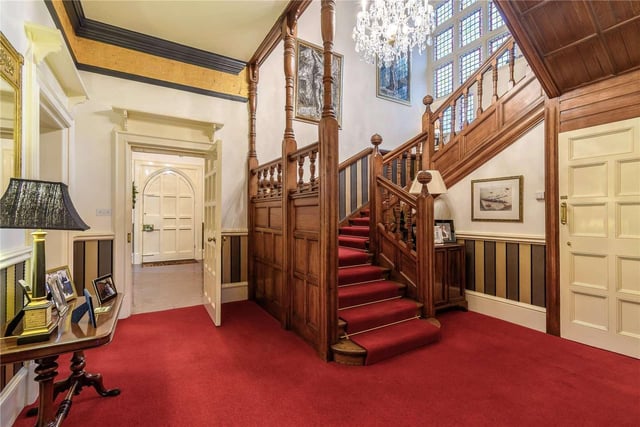 The entrance vestibule and inner staircase hall leads to three principal reception rooms, plus a study and an inner hallway with a secondary staircase.