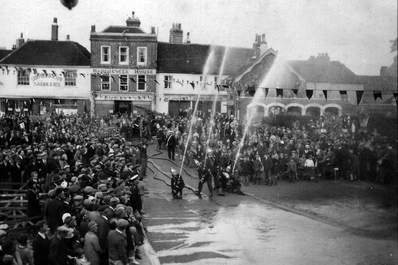The fire brigade putting on a display at the Petersfield Carnival in The Square in 1932
