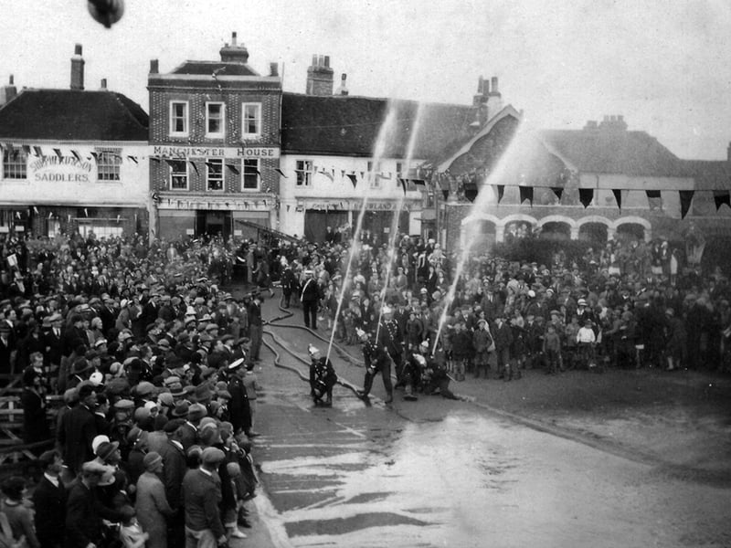 The fire brigade putting on a display at the Petersfield Carnival in The Square in 1932