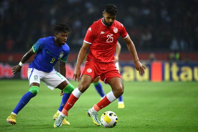 Tunisia's midfielder Anis Ben Slimane fights for the ball with Brazil's midfielder Fred during the friendly football match between Brazil and Tunisia at the Parc des Princes in Paris: FRANCK FIFE/AFP via Getty Images