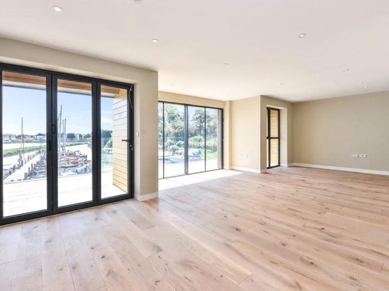 The house has a light and airy feel, with plenty of natural light through the large windows.
