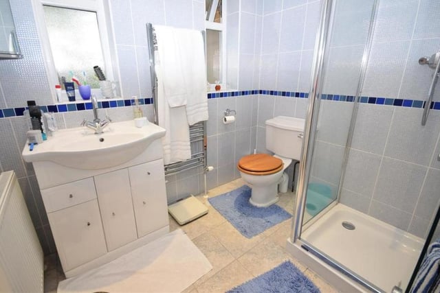 The Milton Drive bungalow boasts a separate shower room, off the hallway, and within easy reach of the second third bedrooms. It comprises a shower cubicle, low-flush WC, was basin in a vanity unit and heated towel-rail.