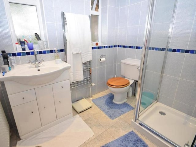 The Milton Drive bungalow boasts a separate shower room, off the hallway, and within easy reach of the second third bedrooms. It comprises a shower cubicle, low-flush WC, was basin in a vanity unit and heated towel-rail.