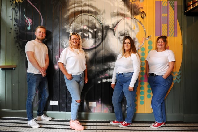 Sal's Famous pizzeria opened in Falkirk's Kirk Wynd, on the corner of Manor Street in May.  Pictured from left, Blair Nisbet, supervisor; Indiana Aitken, manager; Chelsea MacDonald, assistant manager and Leda Sweeney, head cook. Mural by Michael Corr.