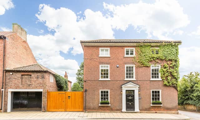There is a large oak gates with an integrated pedestrian entrance giving access to a courtyard at the side of the property providing parking space for several cars.
