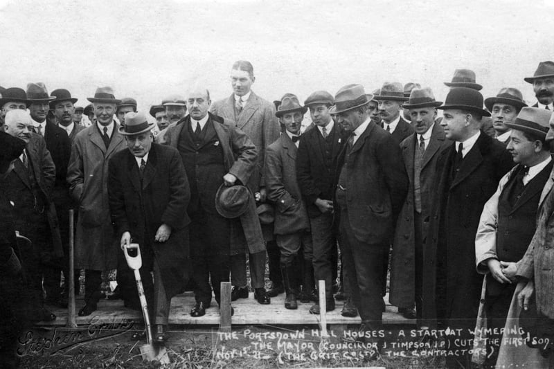 The mayor of Portsmouth cuts the first sod to start the building of council houses at Wymering on Portsdown Hill in 1921. Picture: costen.co.uk