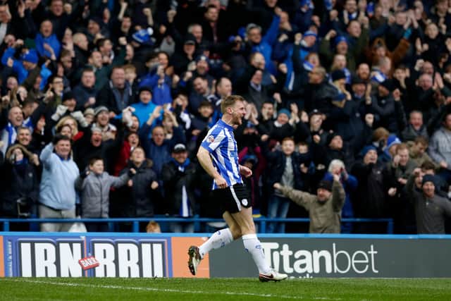 Tom Lees celebrates in front of the Kop after opening the scoring for Sheffield Wednesday against Charlton