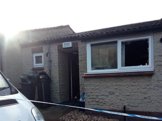 Firefighters had to smash the front window of the flat after they were unable to enter through the front door.