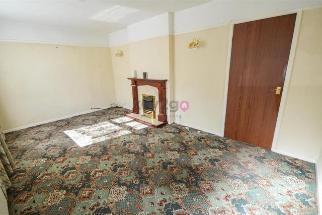 This is a large living room with lots of space for a good size sofa and television.