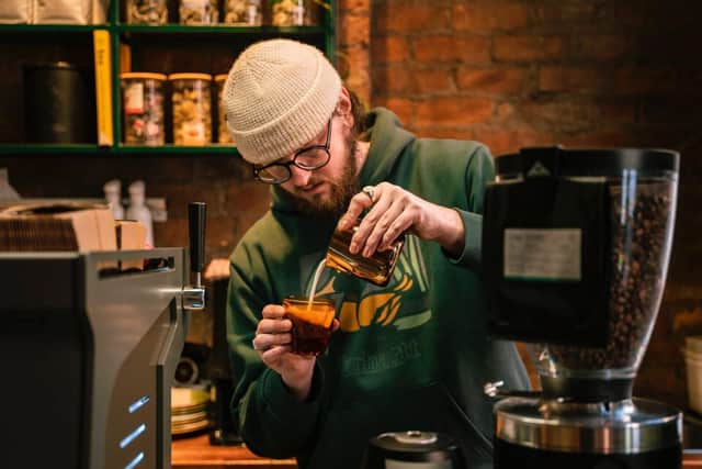 Sam Gilmer spends serious time researching the coffees he serves at Mow's