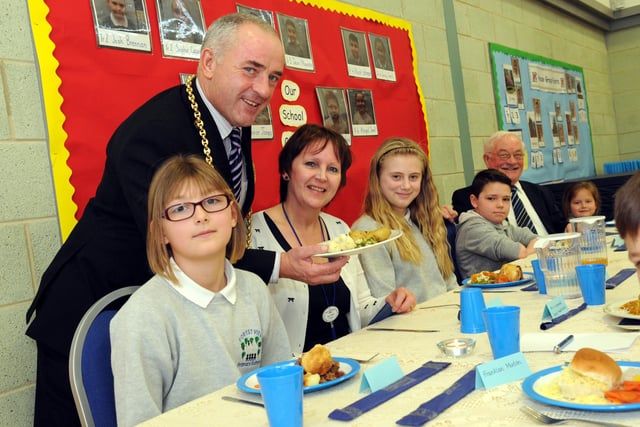 The Mayor Coun Ernest Gibson serves lunch to Forest View Primary School headteacher Cheryl Ward and school council members. Can you remember this from 7 years ago?