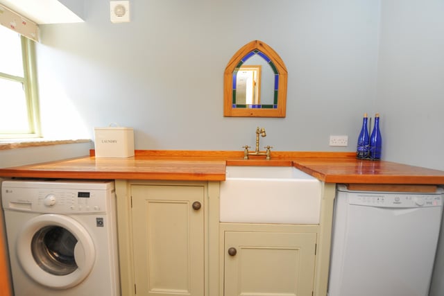 The utility room also has a Belfast sink.