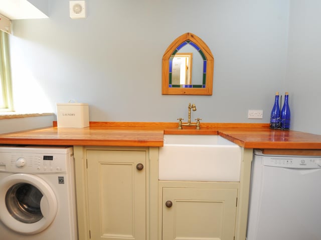 The utility room also has a Belfast sink.