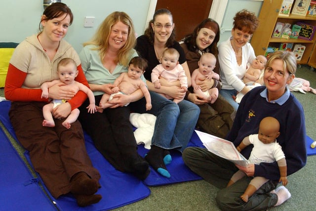 A baby massage session in 2006. Can you spot someone you know?