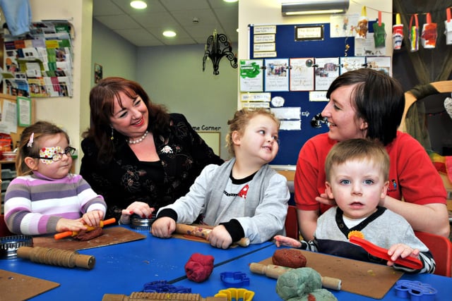 MP Sharon Hodgson with apprentice nursery assistant Katie Wallace at Springboard Sunderland,  Pallion - and these children are having a great time too in this 2011 scene.