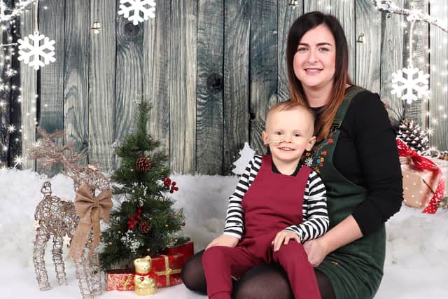 Alfie Powell and mum Emma take part in a Christmas photoshoot during his treatment.