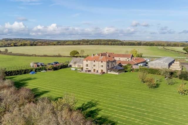 A drone shot of the £895,000 Warsop Cottage Farm, which dates back to the 17th century but has been extensively renovated. The photo shows the huge expanse of land (almost five acres) on which the house sits.