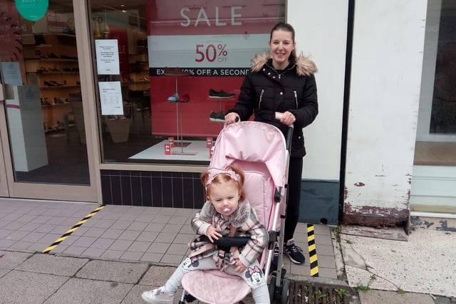 Mum Danielle Tulip and daughter Brooklyn Ramsey waiting for an appointment to go into Clarks shoes.