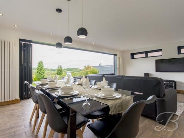 This reception room is open plan with the kitchen, creating a "fabulous sense of space and again, perfect for anyone who enjoys entertaining".