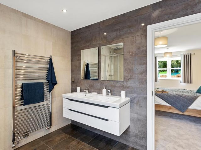 Before we leave the £750,000 Oakerthorpe property, let's take a peek at one of the en suite bathrooms. Smart and stylish.