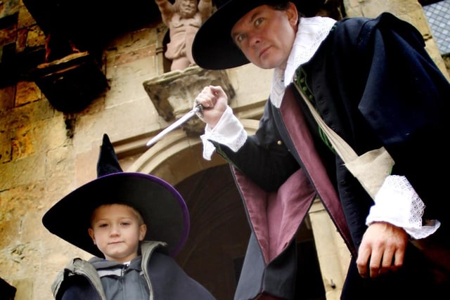 Five-year-old Jay Kennedy with Witch hunter Ian Rycroft of Black Knight Historical at Bolsover Castle in 2010.