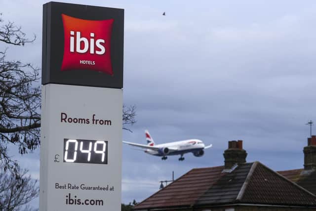 A plane passes over the Ibis Hotel at Heathrow - PA