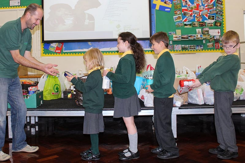 Fens Primary school pupils (left to right) Emily Macklam,  Brooke Paylor, Alex McLauchlan and William Greig with a selection of items that they donated to Jonathan Wales from the Hartlepool Food Bank. Remember this from 6 years ago?
