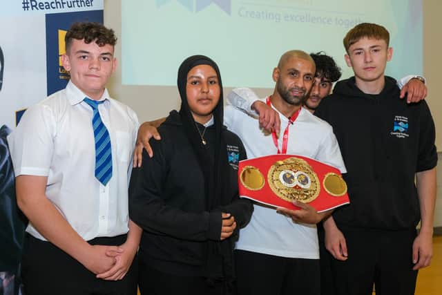 IBF world featherweight champion Kid Galahad returns to Hinde House School to show off his belt.