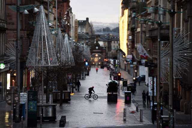 Pedestrians walk through central Glasgow as Britain enters a national lockdown