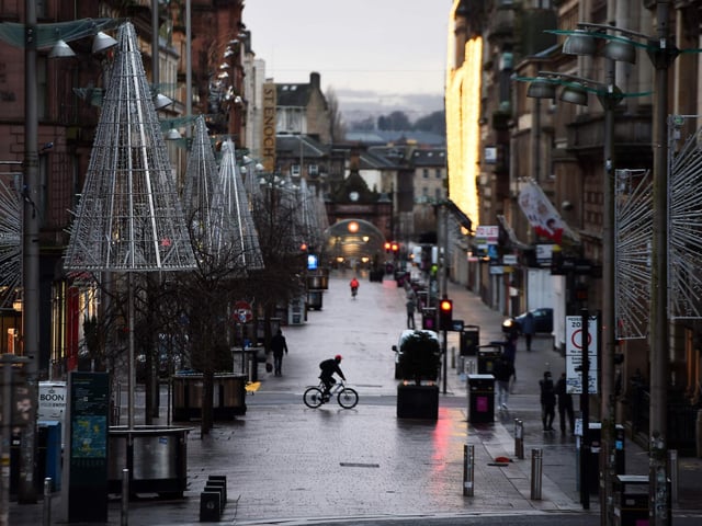 Pedestrians walk through central Glasgow as Britain enters a national lockdown