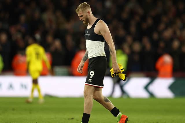 Oliver McBurnie of Sheffield United walks off dejected after defeat to Rotherham United at Bramall Lane: Darren Staples / Sportimage