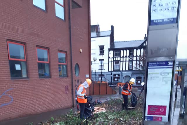 Contractors picking up all the rubbish on Paternoster Row.