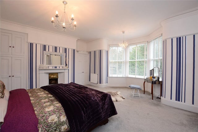 The grand master bedroom features a bay window with views across the gardens, a feature fireplace, fitted wardrobes and a large en-suite bathroom.